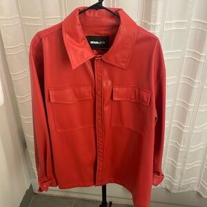 Red leather aka vinyl aka pleather shirt. I purchased this off fashion nova